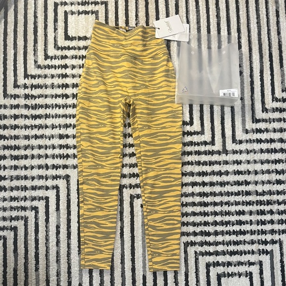 Bombshell Sportswear Pants - Bombshell Sportswear sexy back leggings in honey gold size MEDIUM NWT